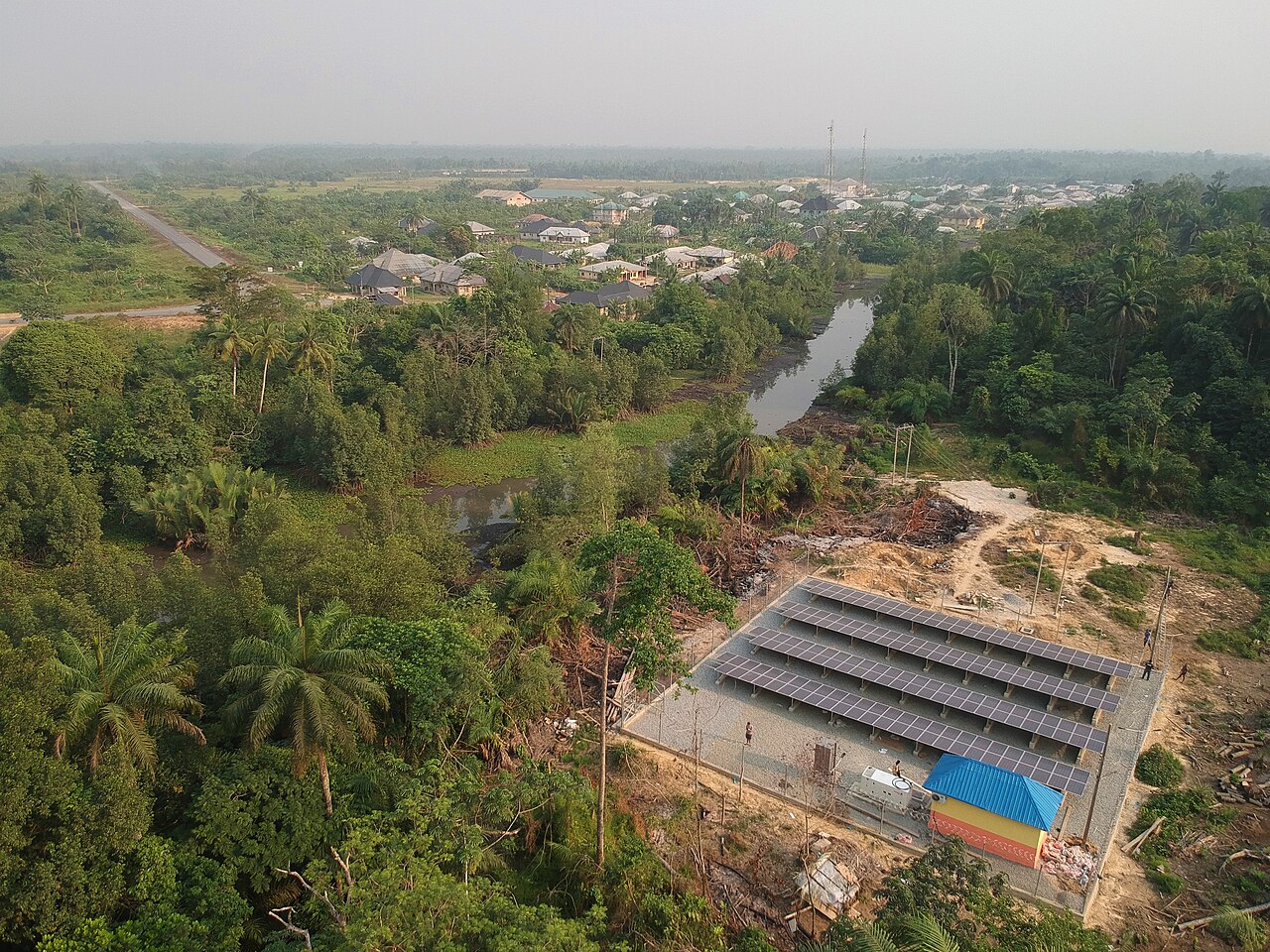 A real solar mini-grid beside a waterway and community in Bayelsa, Nigeria.
